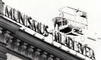 Taking down the label "Communism - the youth of the world" from the building of the Regional National Committee in Nový Jičín in November 1989