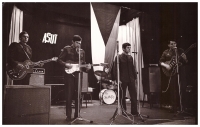 The group Satisfy during the performance at ASUT (the military competition of the folk creativity), sung by Pavel Sedláček (before the military service it was called the group Atlantik from Blansko), behind the drums is Miroslav Kučera, it attracted one member of the jury the most at the time: Pavel Bobek  
