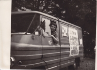 The witness with her postal truck, covered in anti-occupation posters