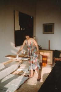 Dagmar painting the furniture dedicated by V. Havel, Rašín Embankment, 1985