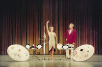 With her husband during a performance before 1989
