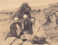 Father Jindřich Černý (centre) with his neighbours - hunters, and a hunted roe deer before the World War II