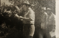 Reading of day order - morning line-up in scout uniforms in 1970