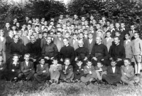 Grammar school in Velehrad, end of the school year 1945/6, second and third year together. Professors from left: Tomáš Špidlík, Blažej Ráček, Karel Závadský (headmaster), Jan Svoboda (rector), Frant. Kubíček, Karel Ševela (Gen. Prefect), Boh. Janíček. - between Ráček and Závadský Vl. Ovčáčík, above him on the left Jan Rybář, above his neighbour on the right Josef Hladiš. In the second standing row from the right Frant. Měsíc. Above Ševela, St. Peroutka, neighbour on the right J. Stojaspal. Above the head of Kubíček, Ant. Krejčiřík. Of the five standing at the very top, the fourth from the left is Josef Jakubec