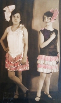 Mother (on the right) with her friend in hand-sewn skirts 
