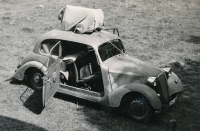 The family car Tatra is carrying the child's bed to Sumava, 1959