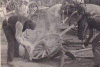 Working in the great-grandfather's forge (with a sledgehammer), 1929