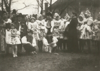 A group of visitors of a First Mass in Olomouc, dressed in folk costumes