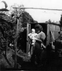 Zdeněk Serinek with his grandmother Marie (Josef Serinek smoking a pipe on the very right).