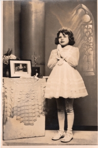 The first Holy Communion at age 10, 1963