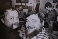 Roast pork feast at the Žižkovský family: Oldřich Kulhánek and Jan Souček in the foreground (February 1986)