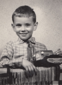 Jiri Löwy as a little boy with an electric crawler tractor at Christmas