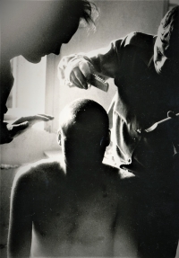 Martin Cvrček (in the middle) during hair-cutting at the military service, Sázava unit, 1986/1987