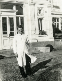 Zdenka Pospíšilová's father Josef Vyskočil in a white coat as a clerk of the Provincial Hospital in Opava in front of the hospital administration building, 1930s