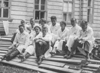 Young students and trainees of the Provincial Hospital in Opava in front of one of the hospital pavilions, 1930s