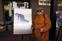 František Příhoda around 2020 in front of a photo of his sister Alexandra