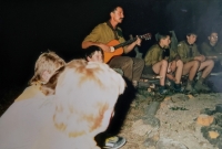 Witness (scout name Hogan) with guitar at a scout camp after 1989