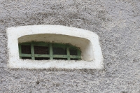 Cellar window of the former tavern at the Cizler family from Gerník (October 2023)