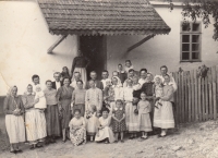 The Cizlers with relatives and neighbours from Gerník in front of their house (turn of the 50s and 60s)