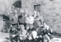 Parents of the witness (standing in the middle), relatives, on the right in squatting position wife of the witness. Marie, left in the foreground, and their children Alexei and Natalie, 1990s