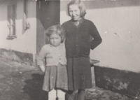 Helena Bobková (left) with her cousin in front of the family house in Valeč, early 1950s