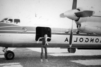 Climbing out of a Mongolian airplane in Gobi, Mongolia, 1979