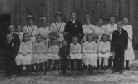 Mother of the witness at a young age, fourth from the left above