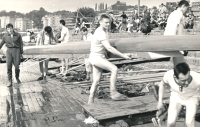 Bohumil Janoušek in 1960 on Střelecký ostrov in Prague. Carrying the boat in the middle foreground