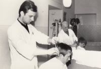 Antonín Tejkl with his father at work in a barber shop, Červená Voda, 1972