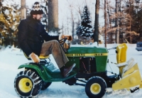 Václav Nedomanský clearing snow at his house in Detroit, late 1970s and early 1980s