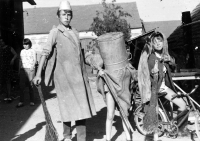 Posing in Skuhrov with relatives. In the foreground from the left cousin Petr, Ludvík Procházka with a pot on his head and cousin Veronika, second half of the 1960s