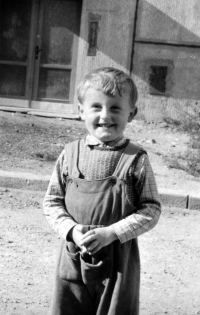 Ludvík Procházka, about three years old, probably in front of a newly completed apartment building in Petřiny housing estate, where the family has just moved