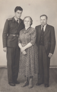 With parents, 1956