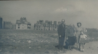 With her mother Milada Vacková, father Josef Vacek and grandmother Marie Dubcová, in the background the burnt down Jezerka, Prague, 1945