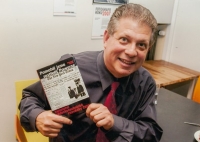 Francis Gary Powers Jr. holding the book We Helped Shoot Down Powers by Věroslav Sobek