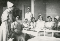 Antonie Tichopádová, back left, leaning against the wall at a children's nurse course in Ostrava, which she completed while working in 1955