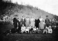 Olga Jaroňová (sitting in the middle in black sweater) and her father and mother (standing from the right), finance barracks in Dlhoň, Slovakia, around 1935