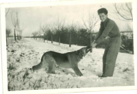 Jiří Hübner in his childhood with a dog