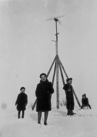 Jiří Stehlík (right) with his mother and brother at the small wind power plant built by his father František Stehlík