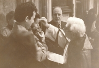 Baptism of Michal Palouš's son, Church of Our Lady before Týn on Prague's Old Town Square, 1988. The son is baptized by priest Jiří Reinsberg