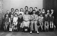 Witness (fourth from the left in the top row) with classmates in 1950