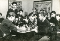 Common room at the school in Hladke Životice. Arnošt Obrusník in a plaid shirt during a popular chess game in 1954