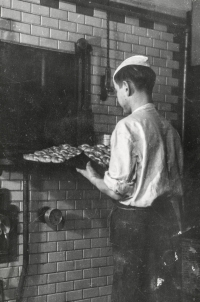 Bakery apprentice Arnošt Obrusník in 1954 at the baker's oven