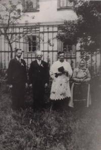 Photograph at the rectory in Louka - the new priest Karel Šindelář, his parents and brother