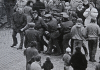 1988 Pavel Záleský dragged by SNB officers / Gathering for the release of Augustin Navrátil from a psychiatric hospital / Olomouc, Commentary by the witness: "The gentleman with the bag in front of me is my father. He shouted at me not to do anything to them. I replied that I wasn't doing anything to them, they were doing it to me!" / photo by Oldřich Kučera