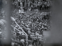 1988 Pavel Záleský dragged by SNB officers / Gathering for the release of Augustin Navrátil from a psychiatric hospital / Olomouc, Commentary by the witness: "The gentleman with the bag in front of me is my father. He shouted at me not to do anything to them. I replied that I wasn't doing anything to them, they were doing it to me!" / photo by Oldřich Kučera