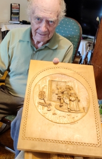 Josef Mrňák shows a wooden relief which he restored, and then he started carving