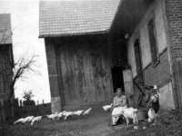 Karel Matuška with his mother Gertruda at the wooden pump made by his father Josef