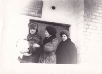 Parents and grandmother with newborn Oleksandra near the maternity hospital in Yasynuvata, 1981