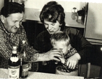 With grandfather and mother tasting rum, early 1970s